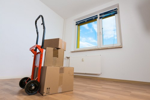 Professional movers carefully handling household items in Liverpool