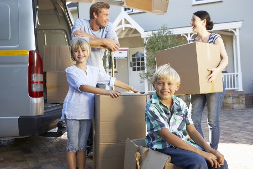 Packers using handling equipment to move items safely